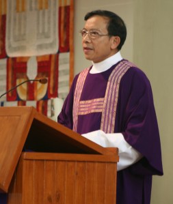 deacon proclaiming Gospel