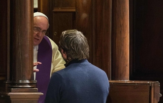 Pope Francis hears confession during penitential liturgy in St. Peter's Basilica at Vatican
